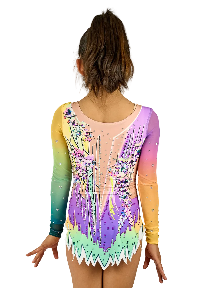 Competition leotard with lilac, green, and yellow gradient with rhinestones.