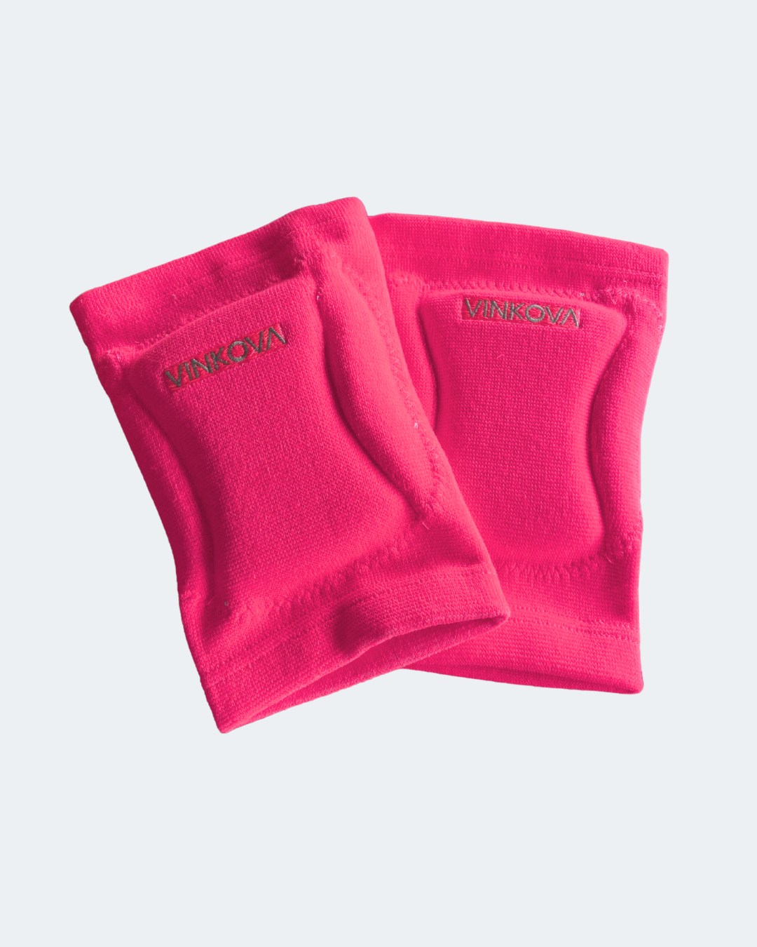 Paire de genouillères Vinkova, coloris rose fluo, logo et maille côtelée.