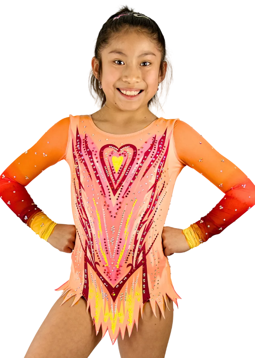 Kinder model rhythmic gymnastics leotard in warm tones with heart motif.