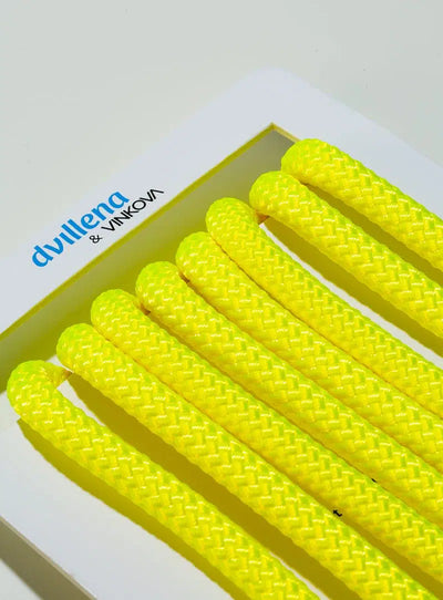 Dvillena & Vinkova fluorescent yellow rhythmic gymnastics rope with non-slip texture for competition.