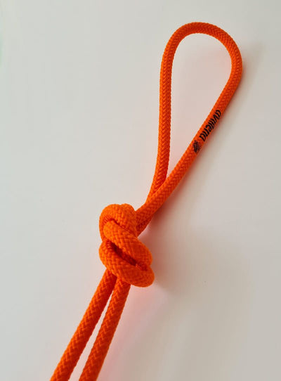 Professional orange rhythmic gymnastics rope made of highly durable and soft synthetic material.