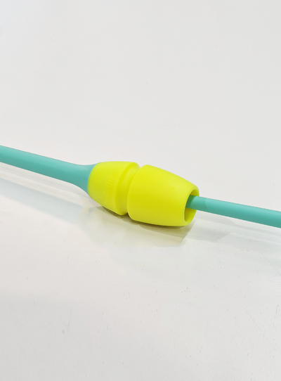 FIG approved connectable clubs in mint green and yellow for competition.