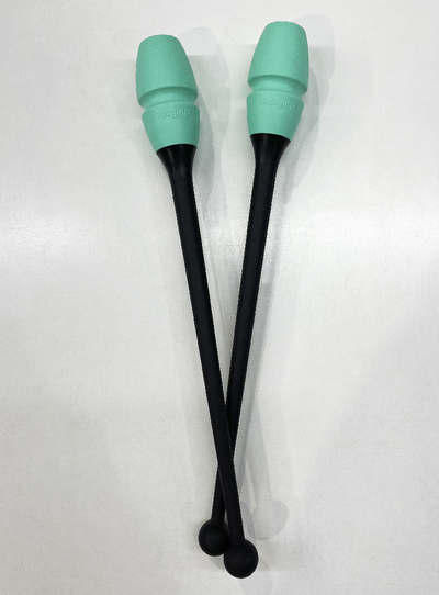 Detail of rhythmic gymnastics connectable clubs black and mint.