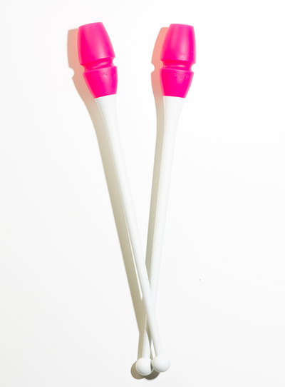 White and fluorescent pink connectable rhythmic gymnastics clubs for training and competition.